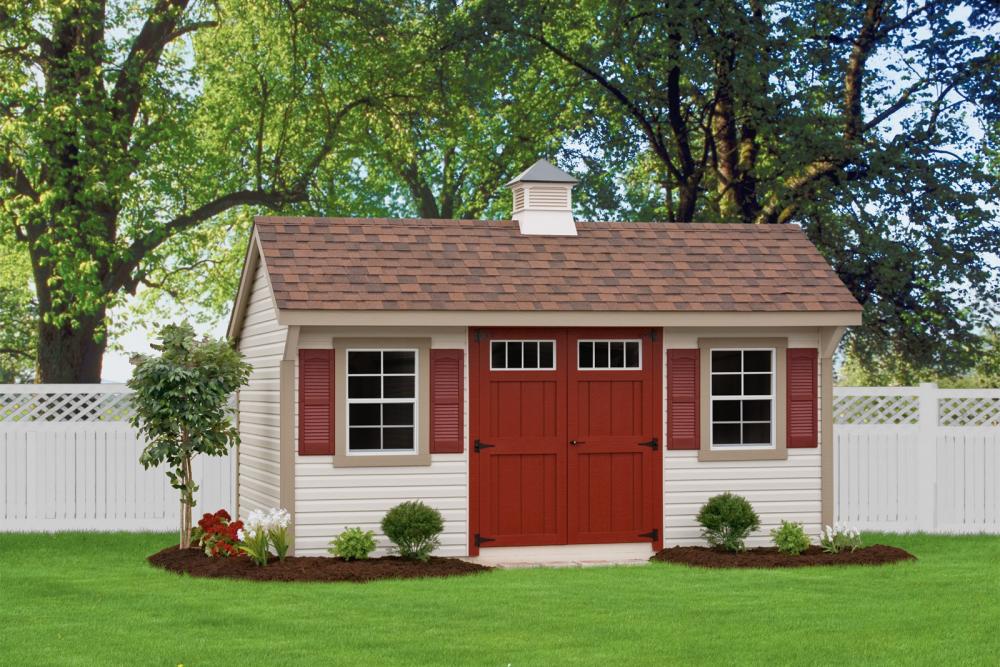Deluxe Quaker 10′ x 16′ • Classic linen vinyl siding, clay trim, red doors and shutters, bark architectural shingles